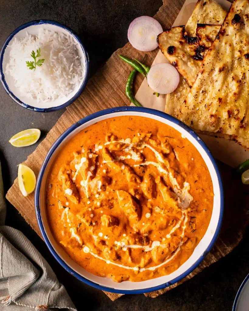 Butter Chicken 2 Overhead shot of creamy butter chicken curry in a bowl with basmati rice on the side