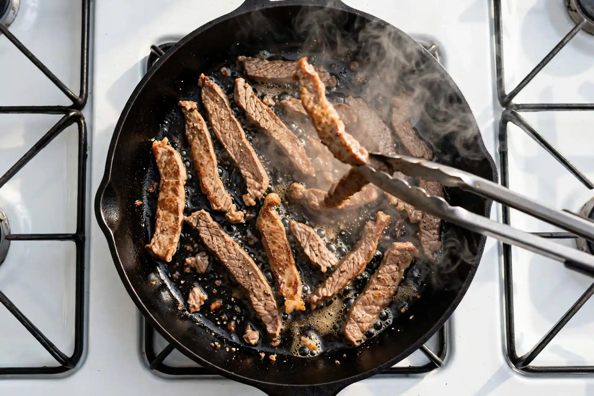 Beef Stroganoff 3 Searing thin strips of beef in a hot skillet for stroganoff