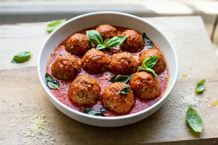 Turkey Meatballs 6 Turkey meatballs simmering in marinara sauce topped with basil and Parmesan
